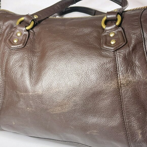 Sophisticated Brown Leather Travel Bag with Gold Accents by Coach - Picture 16 of 16